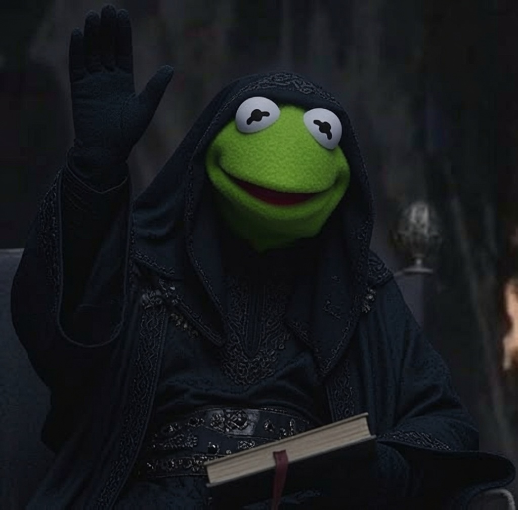 Hooded Kermit raising a hand in blessing, holding a dark book